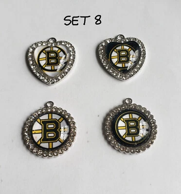 Venta, nuevo lote 4 piezas dijes del equipo de hockey Boston Bruins NHL, vidrio superior, piedras circonitas Foto 1 de 4