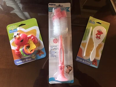 Sesame Street Beginnings Elmo Cepillo y sonajero para bebé + Cepillo para botella BabyKing. Rosado Foto 1 de 4
