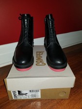 black boots with red soles