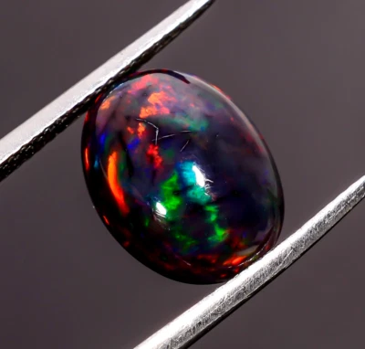 Piedra preciosa suelta cabujón forma ovalada ópalo etíope negro natural 2,5 quilates 12X9X5 mm Foto 1 de 3