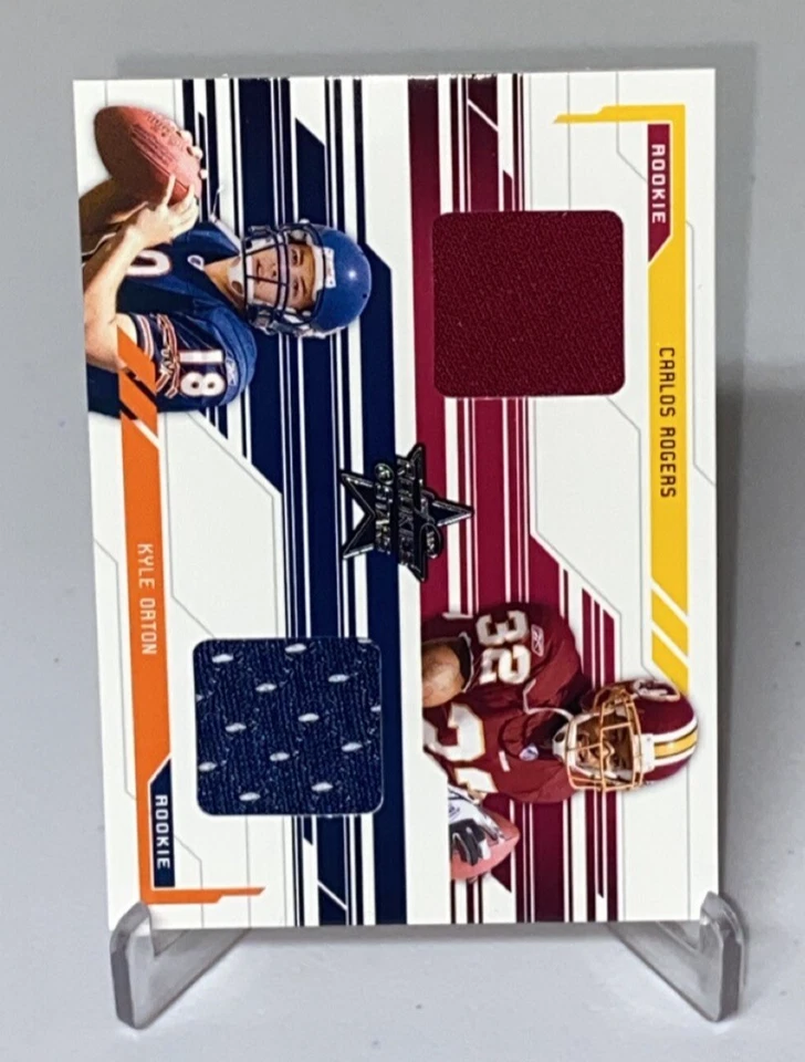 2005 Leaf Rookies & Stars Dual Rookie Jersey /500 Kyle Orton Carlos Rogers RC - Image 1 of 3