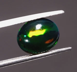 Piedra preciosa suelta cabujón forma ovalada ópalo etíope negro natural 1,02 quilates 8x6x4 mm - Imagen 1 de 3