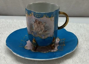 Vintage Austria Vierfuß Tasse und Untertasse 3" mit Cherubs - Bild 1 von 5