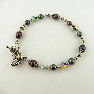 Pulsera de cuentas con dije corazón de San Valentín, hecha con cuentas de cristal de Swarovski - Imagen 1 de 4