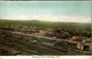 PHILLIPS, WISCONSIN - BIRDSEYE VIEW OF TOWN - TRAIN - OLD POSTCARD - Picture 1 of 2