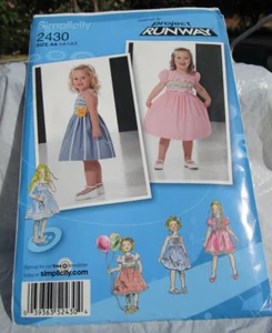 NEW Simplicity sewing pattern 2430 child's girl's dress size AA (1/2, 1,2,3) - Picture 1 of 2