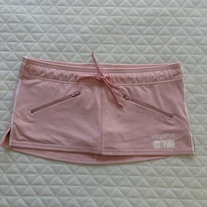 Microfalda Hollister Y2K tiro bajo talla M bebé rosa Skorts tenis bolsillos preppy - Imagen 1 de 11