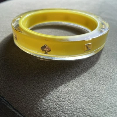 Kate Spade Spot The Spade Yellow Lucite Acrylic Bangle Bracelet Gold Logo  7.75” - Image 1 of 4