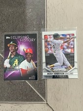 (2) Rickey Henderson 1- 2014 Panini Prizm #151 & 1-2015 Topps EH-1 w Lou Brock