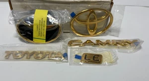 Toyota Camry LE Gold Emblem Kit Part# 0057A32972 Toyota NOS Vintage OEM - Picture 1 of 6