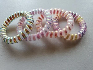 Spiral Haargummis schillernd Telefonkordel Haargummis Haarspulen Armbänder 4 Stück Set - Bild 1 von 3