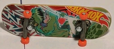 Tech Deck Hot Wheels Fingerboard – T-Rex Dino Graphic – Orange Wheels – Used - Image 1 of 2