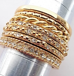 Stacking Layer Rings Set of 7 Band Rhinestone Swirl Gold Tone Size 7 VERY NICE! - Picture 1 of 5