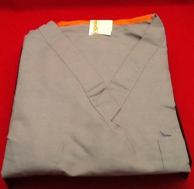 NUEVO TOP EXFOLIANTE ANGELICA 683 NTZ MANGA CORTA PEQUEÑO AZUL CON NARANJA EN EL CUELLO Foto 1 de 4