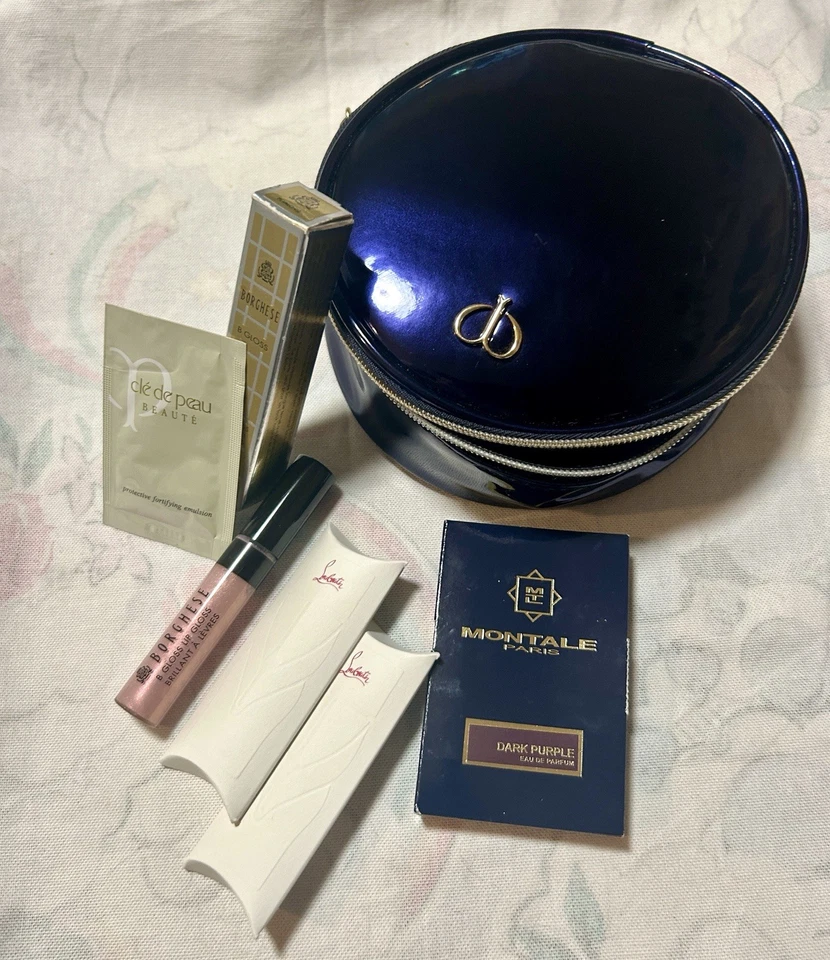 Juego de belleza de lujo - Montale, Louboutin, Clé de Peau, brillo de pétalos Borghese + bolsa Foto 1 de 4