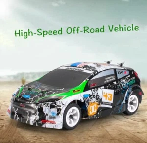 WLtoys K989 Telecomando Quattro Ruote Drive Caricabatterie Auto Giocattoli Elettrici Mini Race - Foto 1 di 5