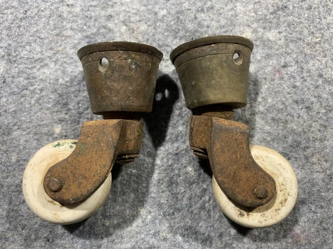 Pair of Antique Brass cup and Porcelain wheel Caster Cover