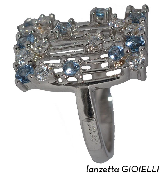 ANELLO BENETTON RETTANGOLARE IN ARGENTO 925 RODIATO CON ZIRCONI BIANCO E AZZURRI - Immagine 1 di 1