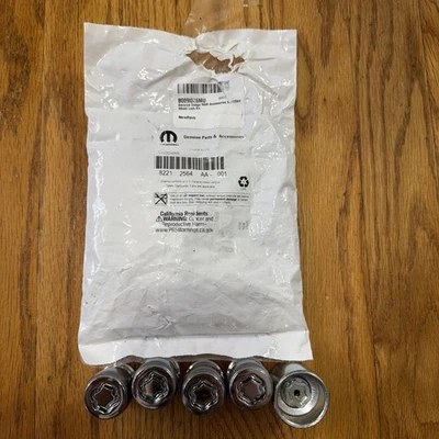 Kit de bloqueo de rueda Dodge Ram Durango Jeep Grand Cherokee NUEVO MOPAR 82212564AA Foto 1 de 4