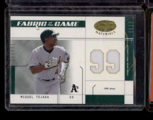 2003 DONRUSS LEAF CERTIFIED MIGUEL TEJADA FABRIC OF THE GAME JERSEY CARD 34/99 - Image 1 of 2