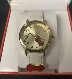 Reloj Hello Kitty Sanrio Cara Dorada Arco Rojo Joyas 2024 Japón Banda Blanca Nuevo en Caja Raro - Imagen 1 de 8