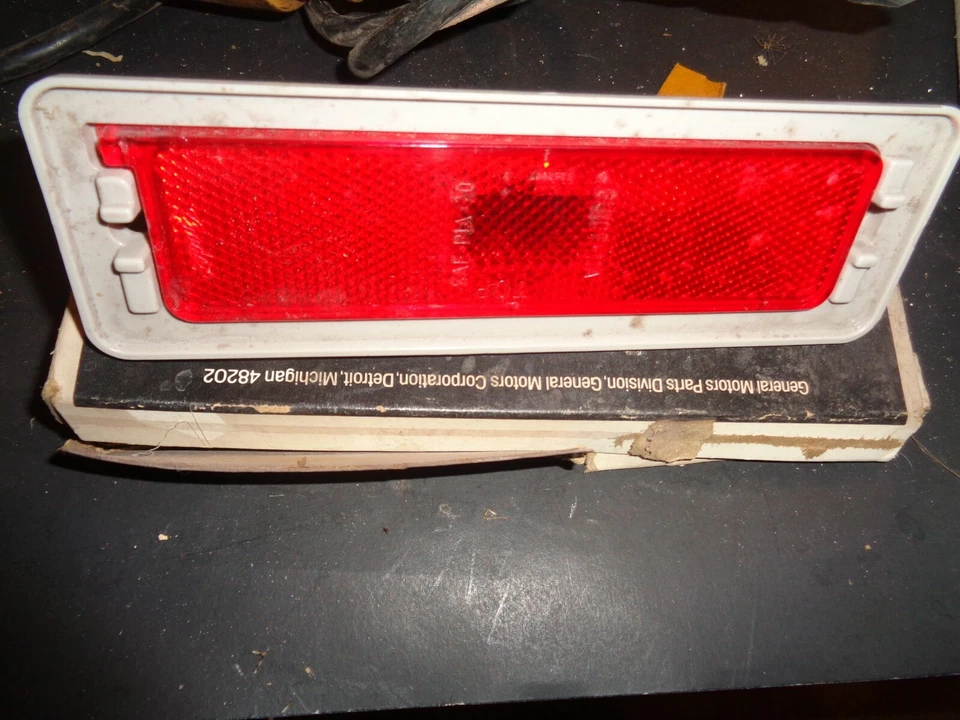 NOS 75-79 Chevy Nova Ventura RH Rear Sidemarker Housing Red Lens GM 5962660  - Image 1 of 1