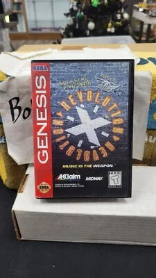 REVOLUTION X SEGA GENESIS VIDEO GAME IN CASE NO MANUAL - Image 1 of 4