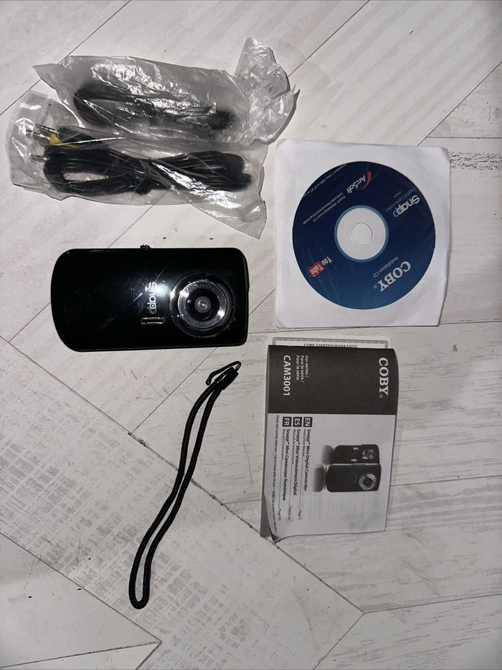 Coby Snapp Video Camera Camcorder With Disc Cords Manuals Strap Works Tested - Image 1 of 4