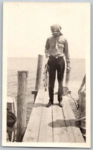 1930s Original Snapshot Photograph Man On Dock Pier String of Fish Fisherman - Picture 1 of 2