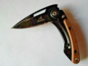 Gerber Folding Utility Knife has Belt Clip & Thumb Stud,Black Blade w/ wood stop