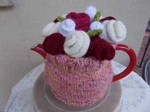 TEA COSY - HAND KNITTED TEA POT COSY WITH OODLES OF ROSES ON TOP. (COZY-COZIE). - Picture 1 of 4