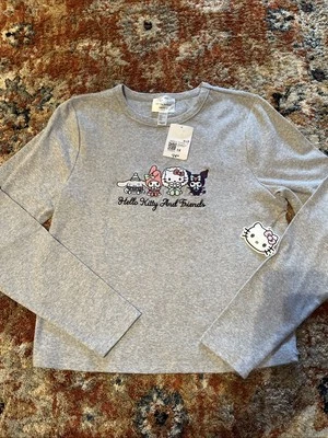 Nuevo con etiquetas Top para mujer Hello Kitty x Forever 21 Plus con logotipo de invierno manga larga gris 1X Foto 1 de 4