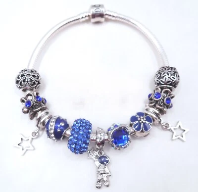 AUTÉNTICA PULSERA DE PLATA CON ASTRONAUTA ESTRELLAS ESPACIALES LUNA CIRCONITA AZUL ¡DIJES TEMÁTICOS! Foto 1 de 4