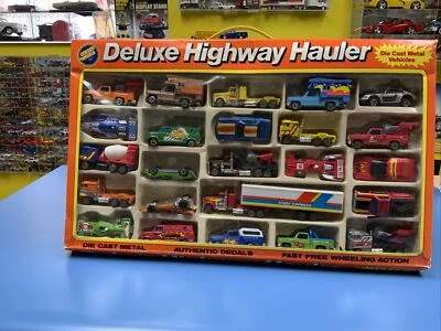 GOLDEN WHEELS DELUXE HIGHWAY HAULER  DIE CAST METAL  24 VEHICLE SET - Image 1 of 4