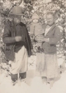 1940s Grandparents With Child Snowy Background Winter Family Portrait - Picture 1 of 3