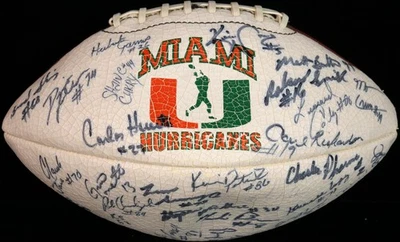 Dwayne "The Rock" Johnson ~ Signed 1990 Miami Hurricanes Team Football ~ PSA DNA - Image 1 of 4