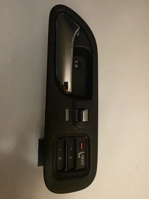 01-06 Acura MDX Manija de puerta interior delantera izquierda, interruptor de memoria de asiento negro OEM Foto 1 de 3