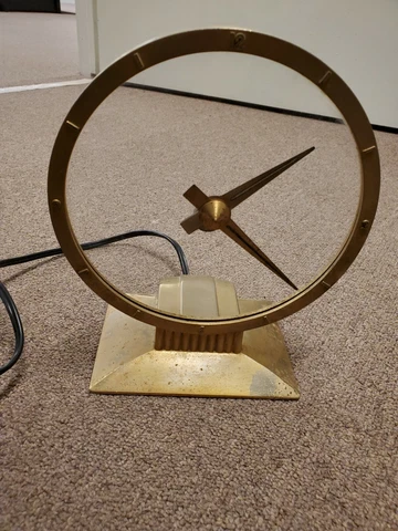 Jefferson Golden Hour mystery clock, glass moves to keep time, working Cover
