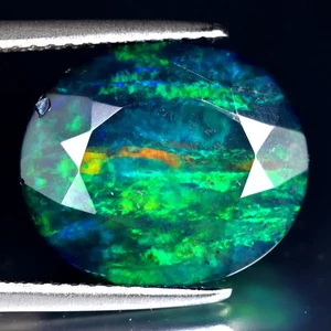 3.53 ct Fabulous Oval (14 x 12 mm) Flashing 360 Degree Multicolor Black Opal - Picture 1 of 2