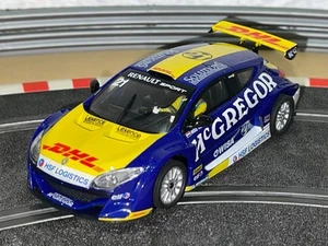 1250- Scalextric SCX Renault Megane Trophy 2010 #21 Mc Gregor DHL slot car 1:32 - Imagen 1 de 3