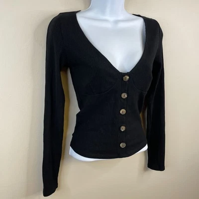 Top corto Reformation para mujer Babydoll cuello redondo mediano acanalado ajustado manga larga Foto 1 de 4