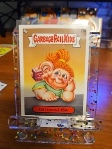 Garbage Pail Kids Listening Lisa 27b Book Worms Common Sticker Gpk - Picture 1 of 1