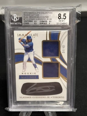 VLADIMIR GUERRERO JR. 2019 PANINI IMMACULATE ROOKIE AUTO DUAL JERSEY /49 BG 8.5 - Image 1 of 2