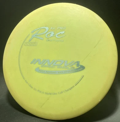 Innova Yellow KC Pro Roc! Disc Golf Mid-Range Penned 180g. Used - Image 1 of 3