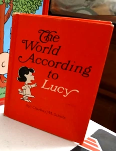 PEANUTS THE WORLD ACCORDING TO LUCY. EXCEPT FOR WEAR AT CORNERS-BOOK IS MINT. 0 - Picture 1 of 1