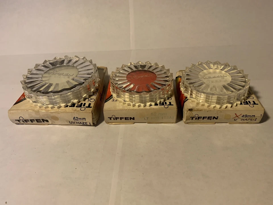 3 NEW IN BOX VINTAGE ASSORTED TIFFEN UV HAZE 1 AND LT RED FILTERS - Image 1 of 1