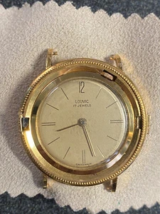 Louvic 17 Jewel watch Movement Liberty Coin case for parts runs keeps time - Picture 1 of 6