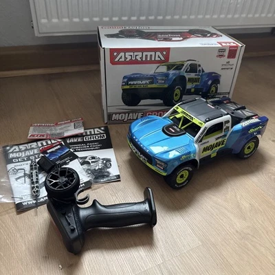 ARRMA MOJAVE GROM Mega 380 4X4 RTR 1:16 Truck RC Auto ARA2104T2 Blau Akku, Lader - Bild 1 von 4