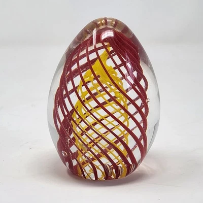 9.5cm  Egg Shaped Clear Glass Paperweight With Yellow Spiral Red Inside Unsigned - image 1 of 4