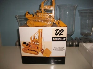 SpecCast Caterpillar D2 Traxcavator escala 1:16 ACMOC con caja - Imagen 1 de 10